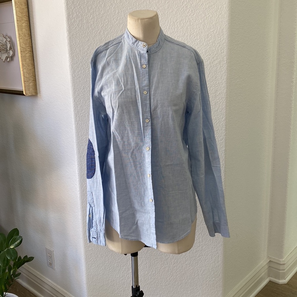 Stand color blue button down shirt